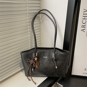 Retro matte black tote bag with fashion lettering and decorative key charm on bag