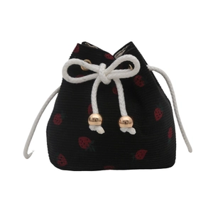 Minimalist black corduroy drawstring bucket bag featuring red strawberry embroidery