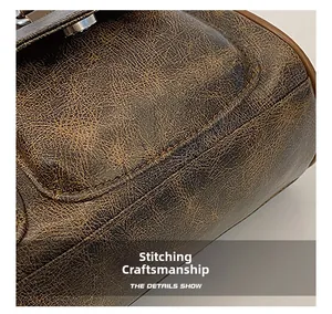 Macro detail showing vintage caramel leather texture and silver magnetic buckle closure