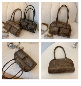 Detail view of vintage PU leather underarm bags with utility pockets and dual straps