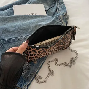 Fashionable leopard print crossbody bag with silver chain strap and smartphone capacity view