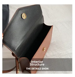 Detailed internal structure of brown stone pattern bag with golden magnetic closure
