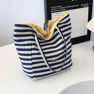 Large capacity canvas tote bag with navy blue and white stripes for commuting