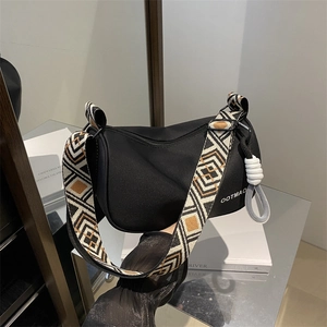 Waterproof oxford dumpling bag with ethnic geometric strap and OOTMAO brand logo
