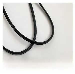 Close-up of black leather cylindrical shoulder straps with fine stitching detail