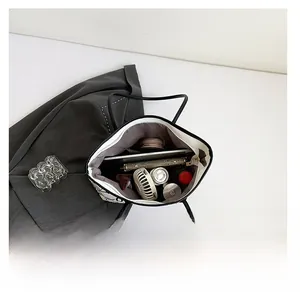 Top view showing the large capacity and interior structure of the white graffiti tote bag