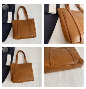 Detailed close-up showing the brown leather texture and stitching of the tote bag
