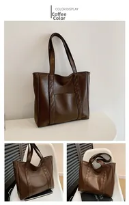 Detail view of large dark brown tote bag with glossy finish and front pocket design