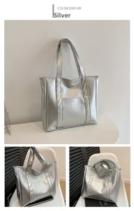 Silver metallic tote bag featuring smooth faux leather texture and spacious front pocket
