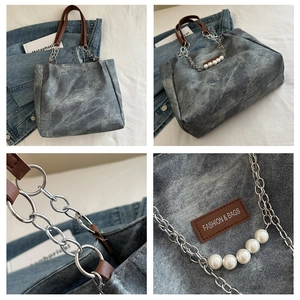 Detail of grey washed denim tote with pearl chain and leather Fashion & Bags logo
