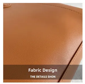 Close-up of caramel brown lychee grain leather texture with precision edge stitching