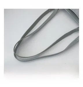 Detailed close-up of light blue faux leather tote bag handles with reinforced stitching