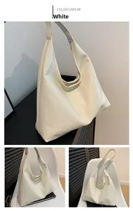 Detail of white vintage Hobo bag showing soft textured PU leather and large capacity