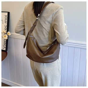 Close-up of the dark brown soft PU leather hobo bag with a silver metal zipper