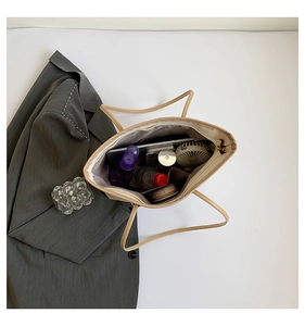 Top view of spacious interior of a beige tote bag showing high capacity for daily essentials