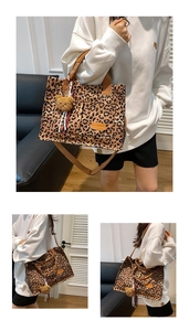 Macro detail of leopard print canvas tote featuring functional pockets and plush bear charm