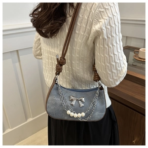 Retro denim dumpling bag with brown leather strap and pearl butterfly chain charm