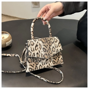 Luxury leopard print handbag with faux calf hair texture and detachable shoulder strap