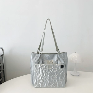Silver wrinkled leather tote bag set with butterfly logo and metallic chain details