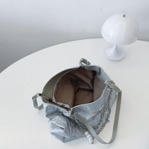 Silver metallic large tote bag with pearl pendant for women showing spacious interior