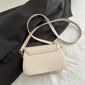 Retro cream faux leather crossbody bag with adjustable strap and gold hardware