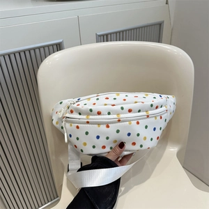 Minimalist white canvas waist bag with colorful polka dots and adjustable strap