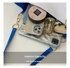 Top view of large capacity tote bag interior with tablet, umbrella and cosmetics