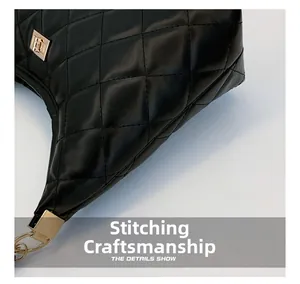 Detailed close-up of black quilted rhombus stitching and premium gold metal buckle