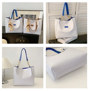 Detail shots of white tote bag with electric blue straps and teddy bear charm accessory