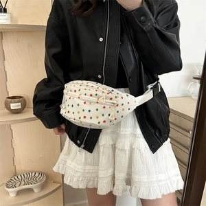Minimalist white canvas chest bag with colorful rainbow polka dots and adjustable strap