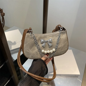 Khaki canvas underarm bag with silver bow, pearl chain and woven leather strap