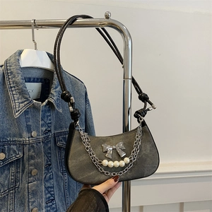 Y2K grey denim underarm bag with silver bow, pearls, and knot leather shoulder strap