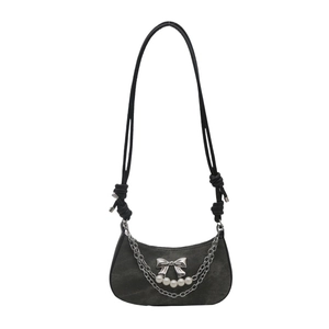 Dark grey crescent underarm bag with silver metallic bow and elegant pearl chain