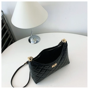 Top view of quilted leather tote bag showing spacious interior and gold hardware