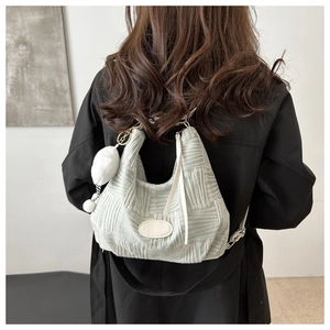 Mint green checkered canvas hobo bag with jacquard texture and white plush pendant