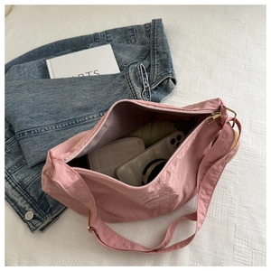 Interior view showing large capacity and pink nylon texture of this versatile tote bag