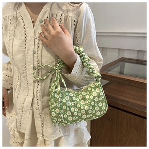 Green floral shoulder bag with daisy pattern and ruched strap for summer outfits