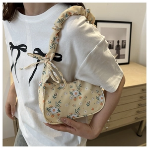 Floral shoulder bag detail with ruffled strap and sweet bow decoration for women