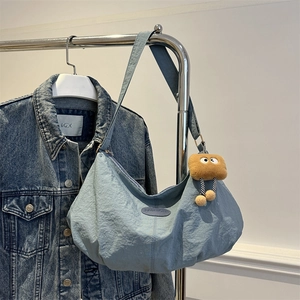Light blue large capacity nylon tote bag with fashion label and brown plush charm