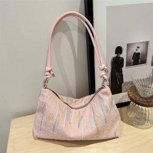 Pink large-capacity tote bag with quilted texture and colorful wavy pattern details