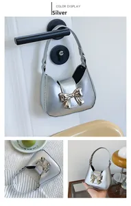 Detailed views of silver bow mini bag with gold buckle and metallic finish chain strap