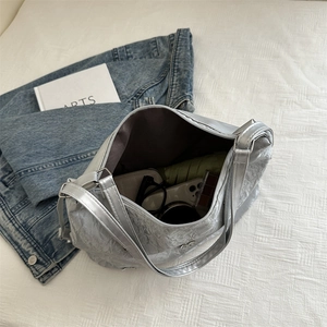 Silver metallic pleated tote bag with large capacity for daily essentials and commuter use