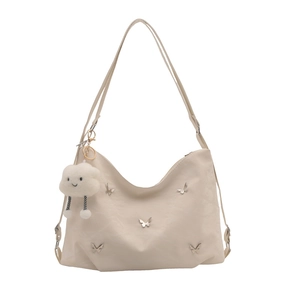 Large cream tote bag with silver butterflies and plush cloud pendant on white background