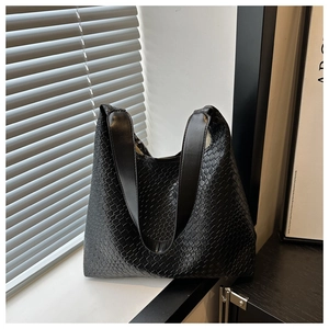 Detailed view of black basketweave Hobo tote bag with a high-quality leather-like finish