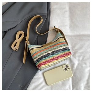 Rainbow striped woven shoulder bag with leather straps and phone for size reference
