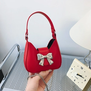 Mini red leather handbag with silver metallic bow and chain strap for women