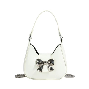 White hobo shoulder bag with a large silver metal bow and detachable chain strap