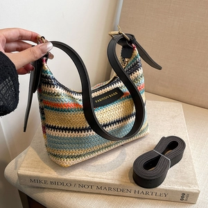 Rainbow striped straw underarm bag with black leather straps and fashion label tag