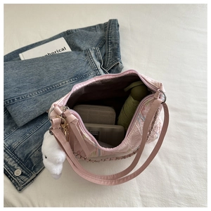 Pink embroidered canvas tote bag with floral patterns and spacious interior capacity