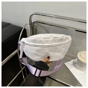 Detail of crescent moon waist bag in off-white weave with lavender purple strap and buckle